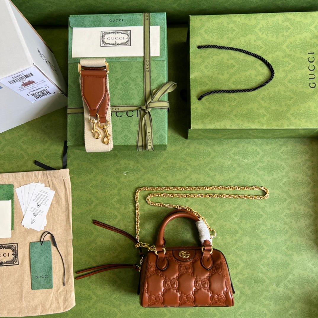 Bolso de mano en piel matelassé con GG Gucci