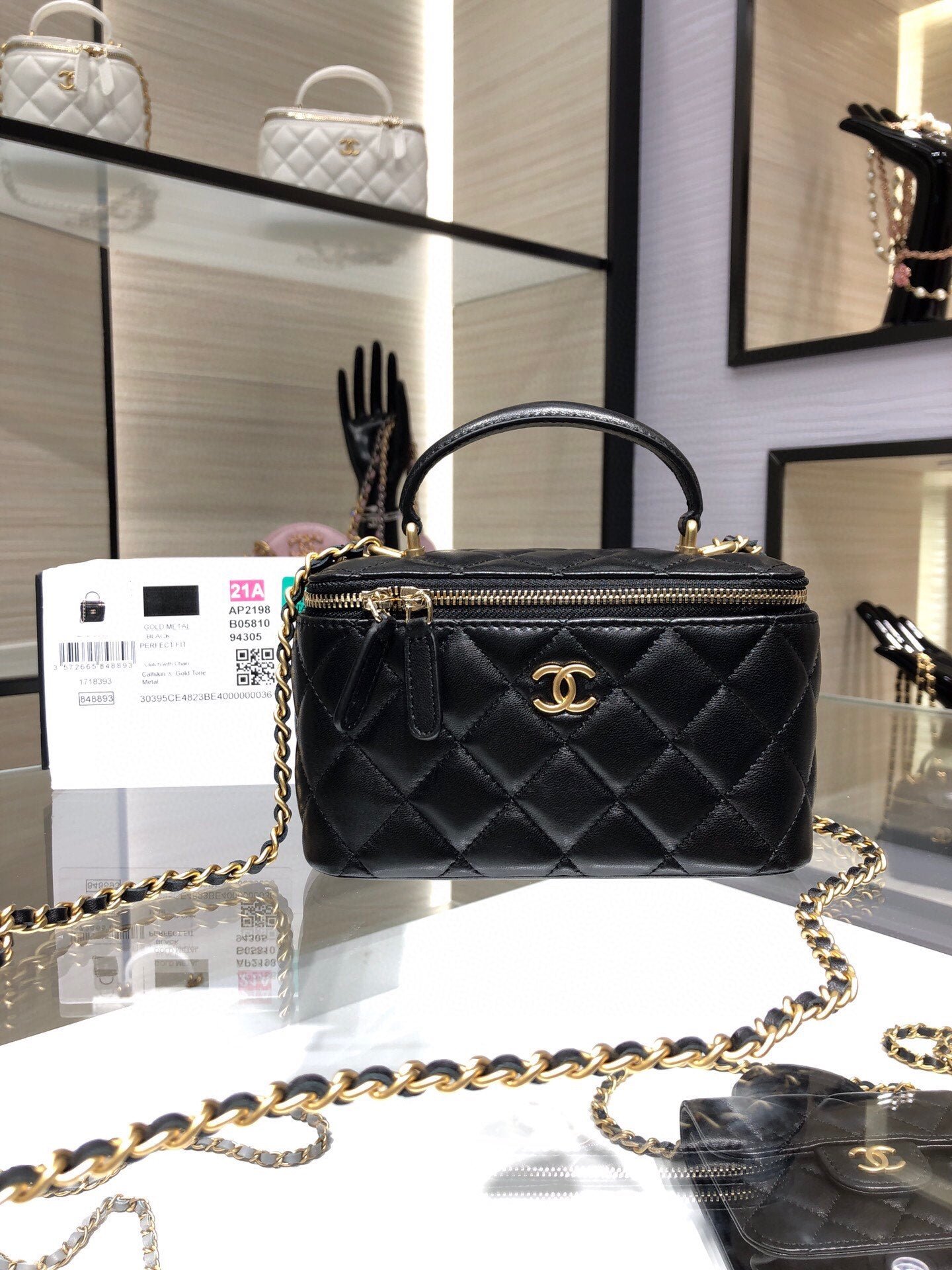 VANITY CASE CON CADENA CHANEL